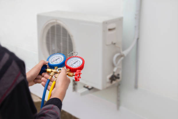 istockphoto-2049876273-612×612 Air conditioning, HVAC service technician using gauges to check refrigerant and add refrigerant.
